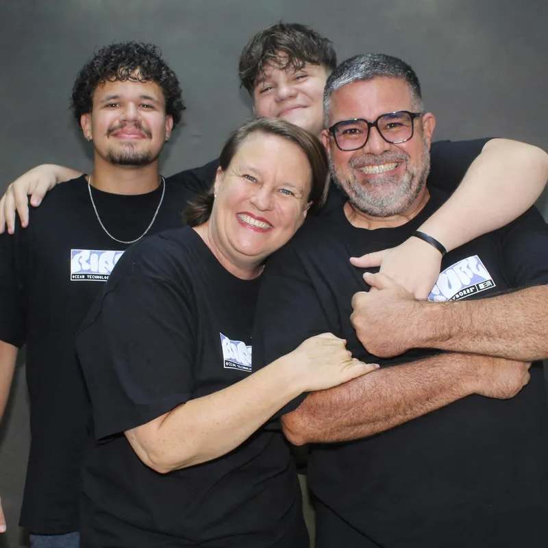 Cléber and Débora in a family hug